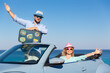 © Sunny studio - Happy couple in love travel by car by the sea