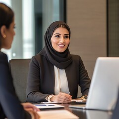 Poster - A person sits at a desk with a laptop, possibly doing work or browsing online