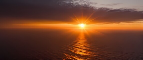 Fototapete - Brilliant shades of sunrise spilling across the sky illuminating the horizon