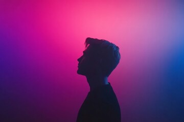 Poster - A silhouette stands thoughtfully against a vibrant pink and purple gradient background, evoking a calm and dreamlike ambiance with ample space for text