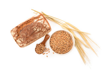 Canvas Print - Tasty bread with wheat spikelets, spoon and bowl of grains on white background