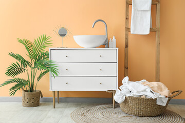 Wall Mural - Interior of laundry room with basket, ladder and sink