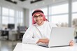 © BillionPhotos.com - A saudi character man sitting working in office