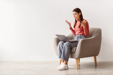 Poster - Lottery win, good luck, success, amazing online sale. Emotional young woman sitting in armchair with laptop, looking at screen, shouting in excitement, winning huge casino bet, copy space