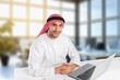 © BillionPhotos.com - A saudi character man sitting working in office