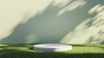 Poster - White cylinder podium positioned on lush green grass, casting shadows from nearby trees and set against a green wall, creating an ideal environment for product presentation