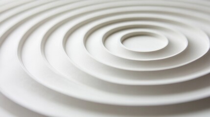 Poster - Concentric circles in various shades, layered to form a ripple-like pattern on a smooth white surface, symbolizing movement and energy