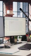 Poster - vertical video empty startup office with pc on desk to be used by programmers building scalable solu