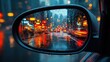 © setiadio - Rainy cityscape reflected in car mirror at night