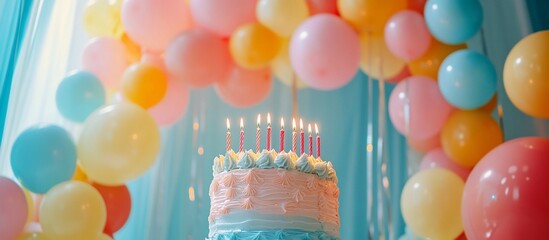 Wall Mural - Colorful birthday cake with lit candles surrounded by festive balloons at a cheerful celebration