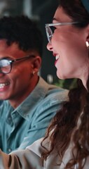 Fototapete - Pointing, talking and smile with web development team in office at night for coding or programming, Collaboration, conversation or problem solving with man and woman programmer in dark workplace