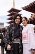 © Hernandez & Sorokina/Stocksy - Cheerful couple wearing kimono looking at camera