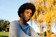 © Adrian Rodd/Stocksy - Outdoor portrait of a man looking at camera with an empowered attitude