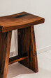 © VICTOR TORRES/Stocksy - Wooden stool with rich grain in minimalist setting
