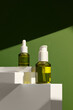 © Marc Tran/Stocksy - Elegant Display of Skincare Bottles With Green and White