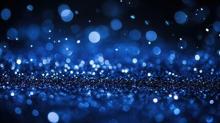 Poster - Stunning Close-Up of Sparkling Blue Bokeh with Shimmering Glitter on Dark Background Creating a Dreamy and Mystical Atmosphere for Creative Projects and Designs