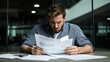 © artzone - Frustrated Businessman Reviewing Documents at Night
