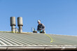 © Alba Vitta Studio/Stocksy - Rooftop Chimney Repair Work