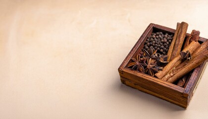 Wall Mural - Aromatic spices in a wooden box. Star anise, cinnamon, and peppercorns.