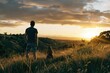 © Сергей Кошкаров - Athletic man and his dog enjoying a peaceful sunset in the hills