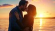 © Santorn - A couple shares a romantic kiss at sunset by the water, capturing a moment of love and intimacy against a beautiful backdrop.