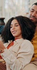Poster - Couple, phone and relax on couch with talk, care and conversation with reading, happy and share post in home. People, man and woman with smile, smartphone and mobile app for social media at apartment
