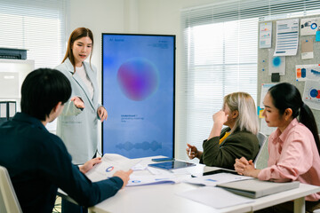 A business people and Startup marketing team, Smiling businesspeople having a discussion in an office. Teamwork, Strategy, Team Brainstorming Strategy Development for Corporate Growth Session.