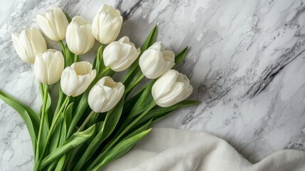 Poster - Delicate white tulips are meticulously arranged on a smooth marble surface, complemented by a soft linen cloth. The combination highlights the elegance of nature, creating a serene atmosphere