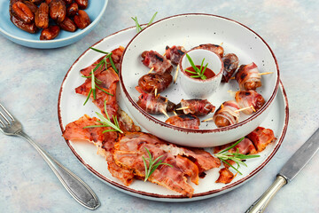 Wall Mural - Italian bacon wrapped dates appetizer.