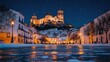 © ROY - Snowy night scene of a town with a cathedral on a hill.