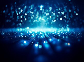 Wall Mural - abstract image of luminous blue bokeh lights and rays emanating from a central point on a dark blue 