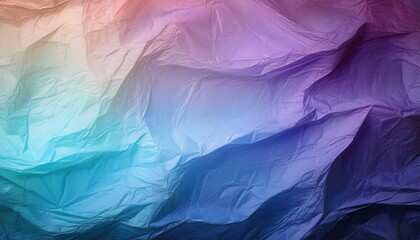 Colorful creased paper surface displaying gradients of purple and blue hues in artistic arrangement