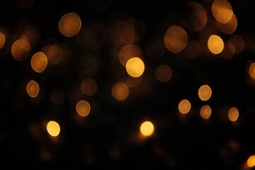 Poster - Golden bokeh lights creating a festive atmosphere on dark background