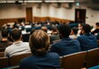 © SERHII - University lecture hall with diverse students attending a class, focus on young adult male