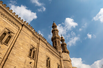 Cairo, Egypt A view in the Khan Al-Khalili bazaar and the Al Azhar Mosque and minaret.