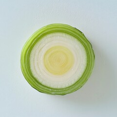 Poster - Fresh leek slice showcasing concentric green and white rings on a clean white background for culinary presentation
