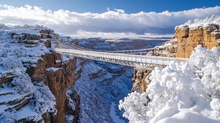 Aufkleber - Suspension bridge spans snow-covered canyon under a bright winter sky