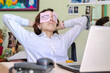© South Pixels - Lazy unproductive young guy wearing funny sticky notes with open eyes on his glasses, sleeping at workplace