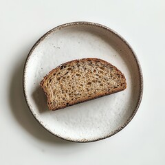 Aufkleber - Rustic slice of rye bread served on a minimalist plate in a simple setting