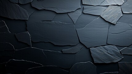 Poster - This image features a close-up view of a textured slate stone wall. The rich, dark colors and unique stone patterns create an elegant and modern architectural element.