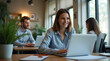 © Osman - business people working together in office