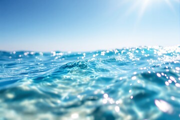 Poster - Bright ocean waves with sunlight reflections on a clear day, blue sky.