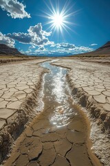 Wall Mural - **  .Sunlit Desert Landscape with Cracked Earth and Reflective Water Stream Under a Vibrant Blue Sky with Fluffy Clouds..**