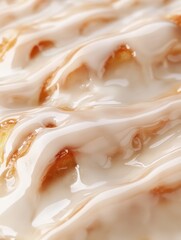 Poster - Freshly baked cinnamon roll topped with creamy icing, showcasing a delicious detail of warm pastry goodness