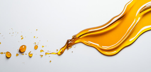 Poster - Golden honey streams across a smooth surface, forming splashes and droplets. The rich color contrasts with the background, showcasing the texture and fluidity of this sweet liquid.