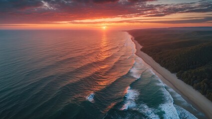 Poster - scenic aerial view of coastal sunset with waves and lush forests along the shoreline perfect for nat