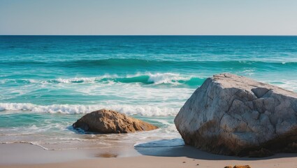 Poster - serene aqua sea waves gently lapping against rocks on a tranquil beach under clear blue sky