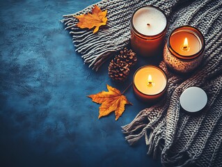 Canvas Print - Cozy autumn candles, scarf, leaves, dark background