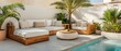 © Chanwit - Couch and table set up next to a swimming pool in a modern outdoor patio area