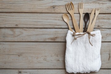 Poster - A bag filled with various wooden utensils for cooking and serving